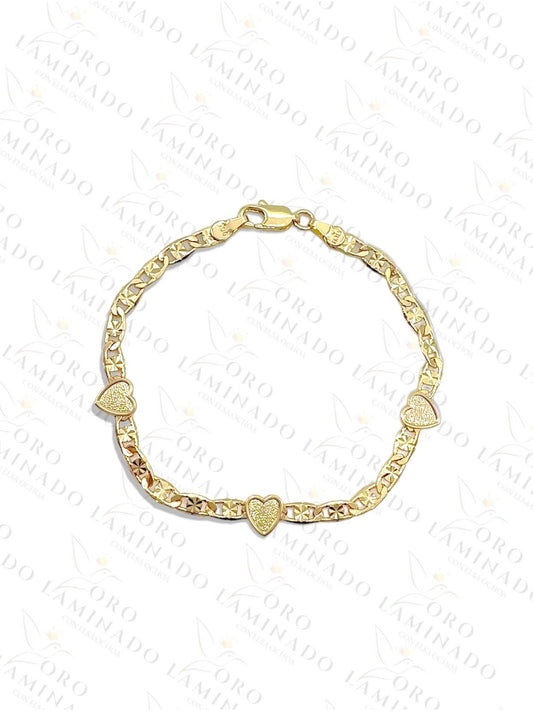 Gold bracelet with three hearts G231