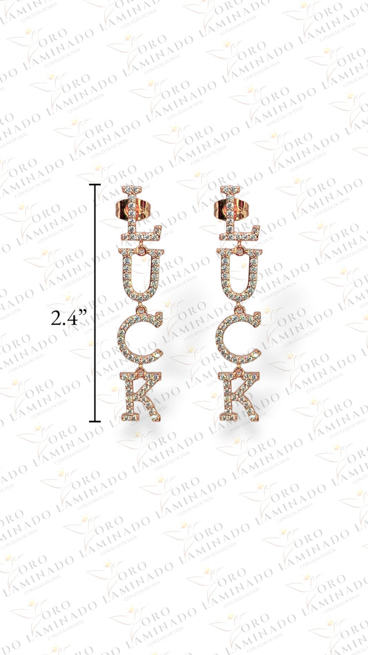 Rose gold earrings with design of the word LUCK G212