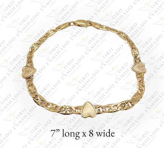 Gold bracelet with three hearts G231